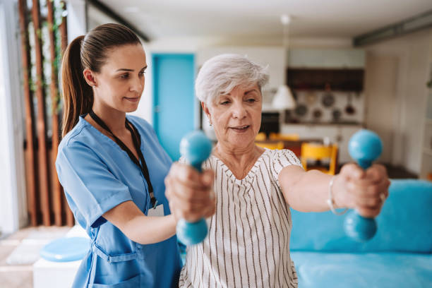 istock Patient at home doing physiotherapy with dumbbell 2185020084
