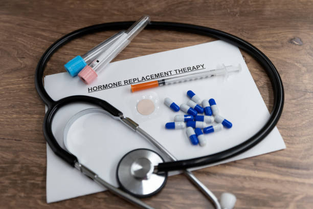 Hormone Replacement Therapy Doctors desk with Hormone Replacement Therapy related items. Stethoscope, paperwork and prescription medications. Bioidentical Hormone Replacement stock pictures, royalty-free photos & images