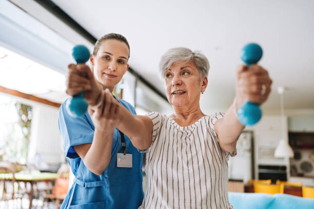 istock Patient at home doing physiotherapy with dumbbell 2185020092