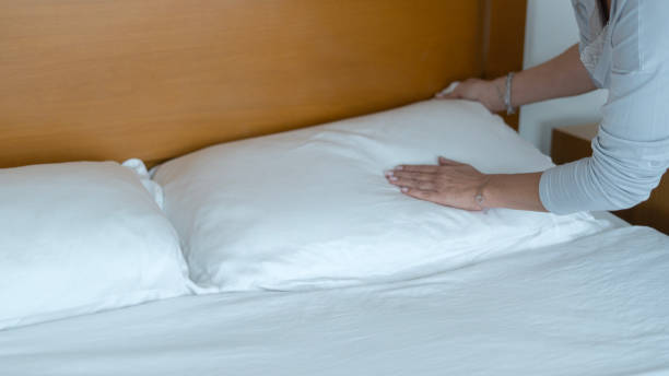 istock woman cleaning hotel room 2185020926