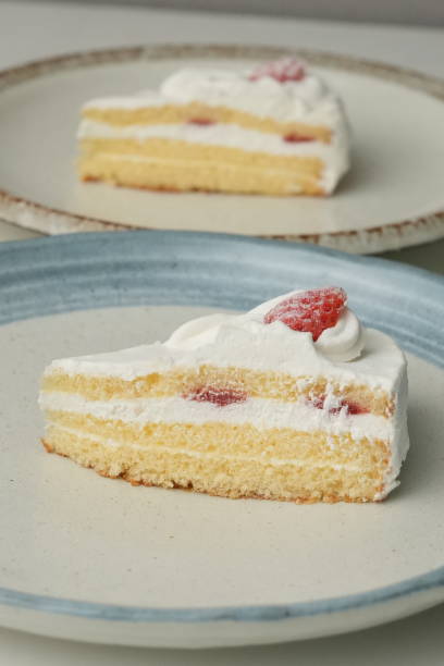 istock Two Japanese strawberry shortcakes on a stylish large plate on a white table 2185022164