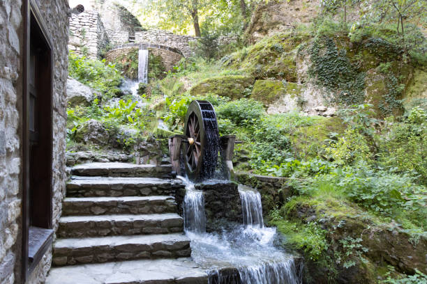 Wooden water mill. Breastshot water wheel system