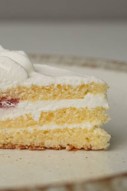 istock One small Japanese strawberry shortcake on a stylish large plate on a white table 2185022976