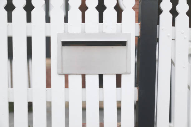 istock Letterbox set within a white picket fence 2185027467