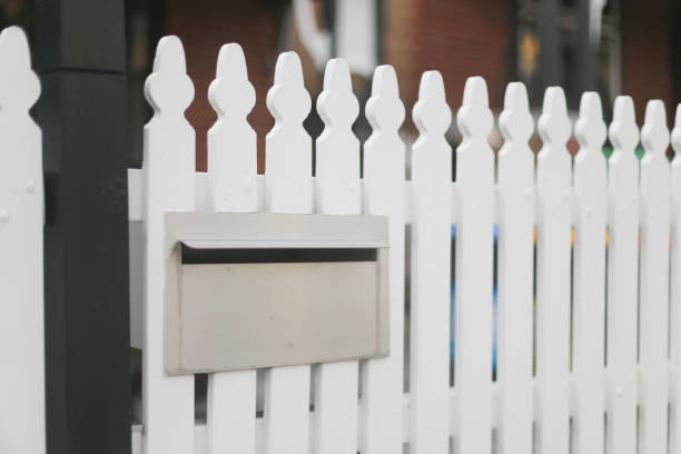 istock Letterbox in a white picket fence 2185028110