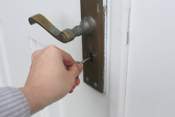 istock Person unlocking a door, close up view 2185028172