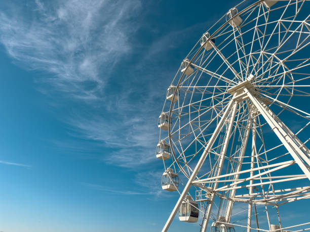 istock White ferris wheel against a clear blue sky in Figueira da Foz 2185028593