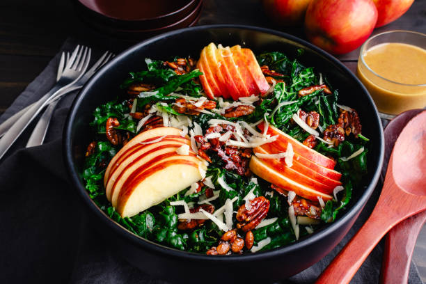 istock Tuscan Kale Salad Topped with Apples, Pecans, and Pepitas 2185029464