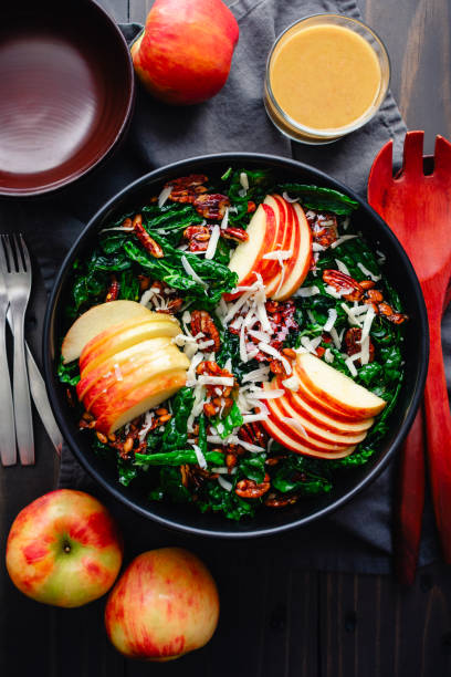 istock Tuscan Kale Salad Topped with Apples, Pecans, and Pepitas 2185029470