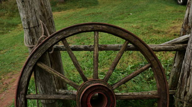istock The old wooden wheel on a hay 2185036979