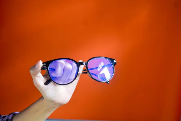 istock Insulated glasses with black frames. The background is orange 2185046981