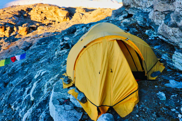 Two person tent for climbers pitched on the rocky slabs above the Mera La, or Mera Pass and base camp,5300 m,for climbers on the Mera Peak Expedition,Himalayas,Nepal
