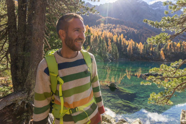 istock Happy Hiker by a Scenic Autumn Lake 2185054470