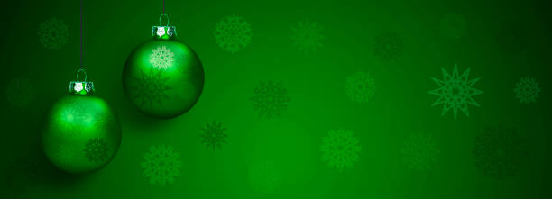 istock Shiny green Christmas bauble on a ribbon 2185055844