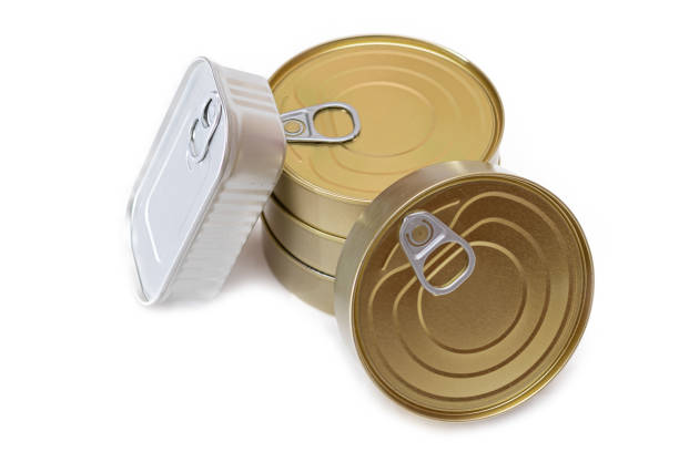 A Group of Stacked Tin Cans with Blank Edges Isolated on White Background. Canned Food. Different Aluminum Cans for Safe and Long Term Storage of Food. Steel Sealed Food Storage Containers - Isolation