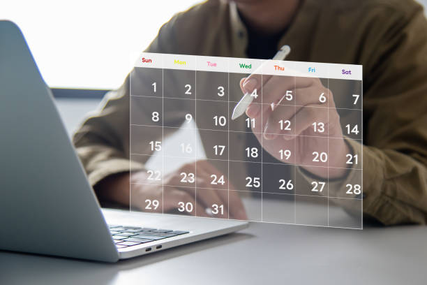 istock A person is interacting with a holographic calendar to organize tasks and meetings.Visualize your schedule with a digital calendar and timeline From business management to marketing. 2185057792