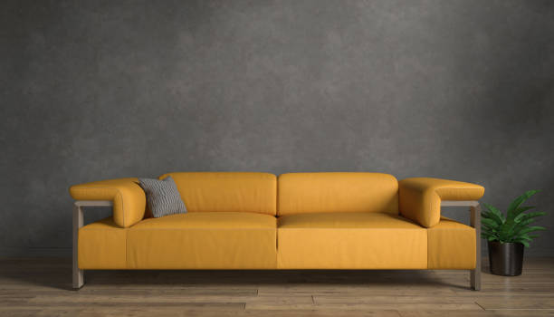 istock 3d rendering of a black mock up wall with orange sofa. 2185058214