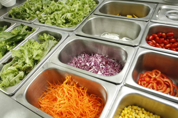 istock Shredded Carrot, red cabbage and vegetables in stainless salad bar 2185061326