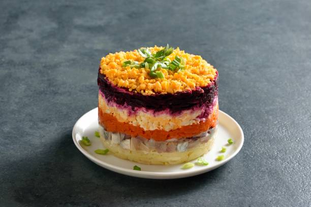 istock Christmas layered vegetable salad with herring and boiled vegetables 2185063088
