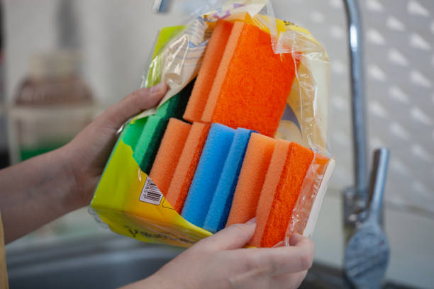 woman hold new double-side sponge