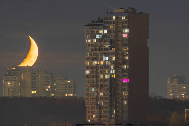 istock Crescent moon over the city. 2185064528