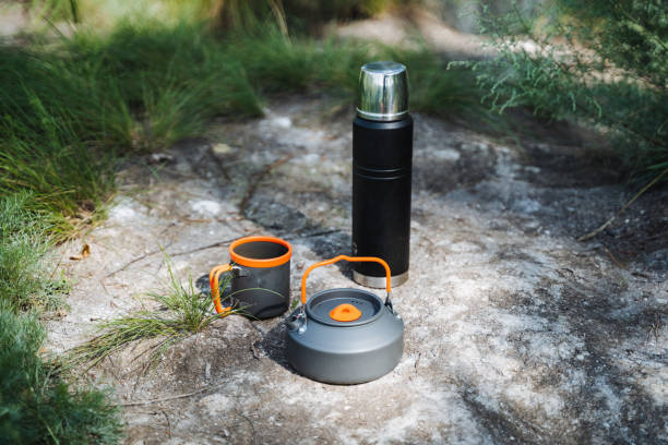 istock When going camping, its important to have a thermos, kettle, and mug for hot drinks. Stay hydrated and enjoy the beautiful scenery around you while on outdoor adventures 2185068772