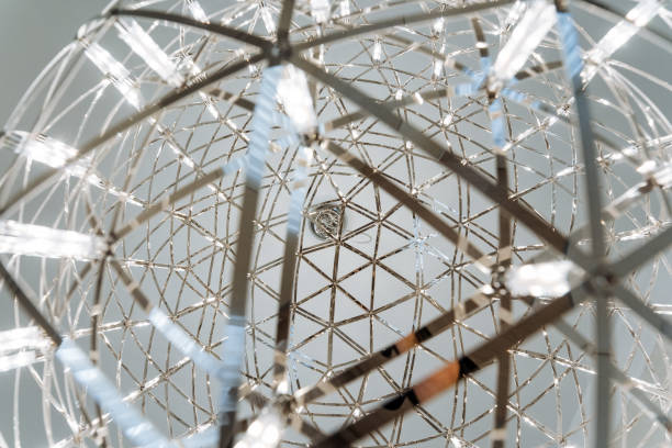 istock The image showcases a stunning metal structure with symmetrical patterns inside, beautifully illuminated by lights. Its a fine example of intricate craftsmanship and thoughtful design 2185068838