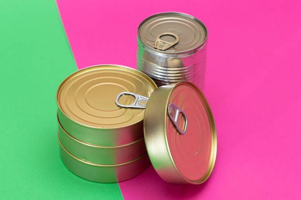 istock A Group of Stacked Tin Cans on Split Green and Cyan Background 2185072299