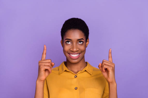 istock Photo of young lady man look indicate fingers empty space select suggest direct proposition  isolated over purple color background 2185073260