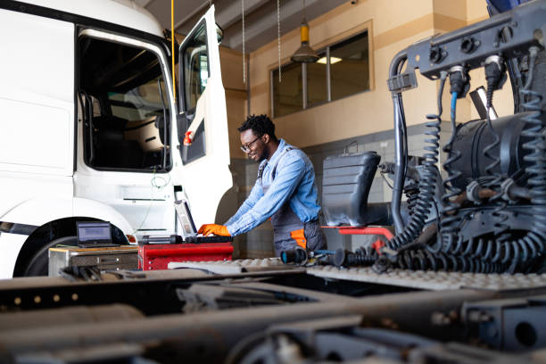 istock Repairing and servicing truck vehicles in workshop. 2185075341