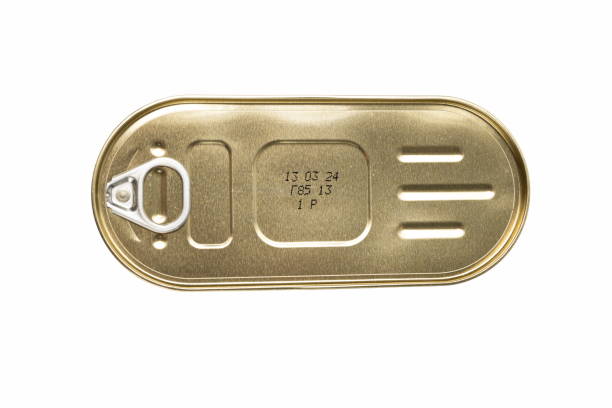 istock Golden canned food packaging with a pull-tab lid is displayed on a white background, highlighting its unique shape and expiration date details 2185076255