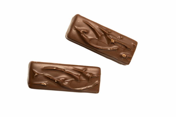 istock A rich brown chocolate bar featuring a glossy, smooth surface is placed on a clean white background, showcasing its tempting design and texture 2185076336