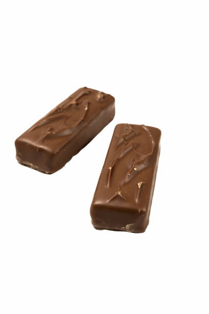 istock Two chocolate bars are placed side by side on a white background, highlighting their smooth surfaces and delightful appearance, perfect for snacking or sharing 2185076338