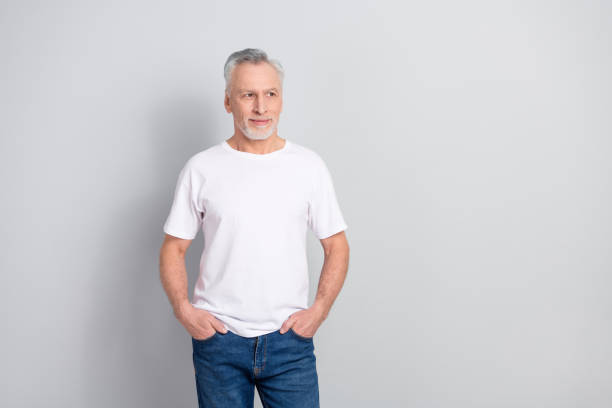 istock Portrait of attractive minded grey haired man deciding copy space isolated over grey pastel color background 2185076351