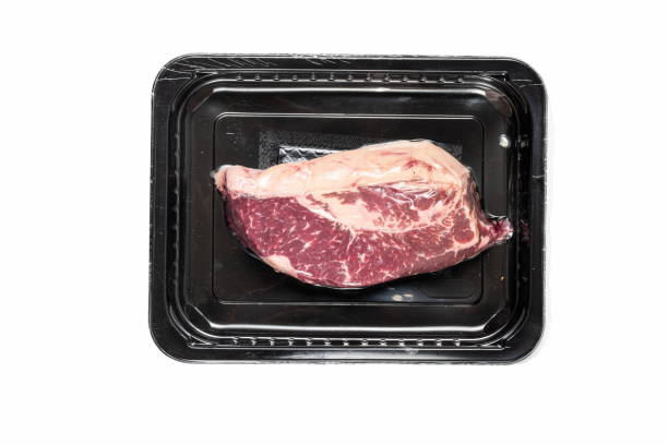 istock A fresh ribeye steak is presented on a black tray, showcasing its marbled texture and rich color, perfect for grilling or roasting in meal preparation 2185076403