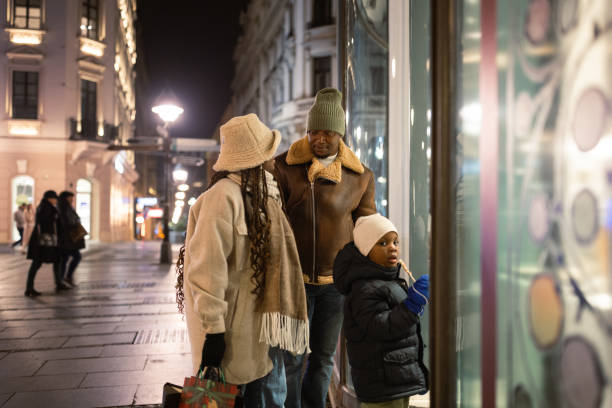 istock Family Window Shopping at Night 2185079249