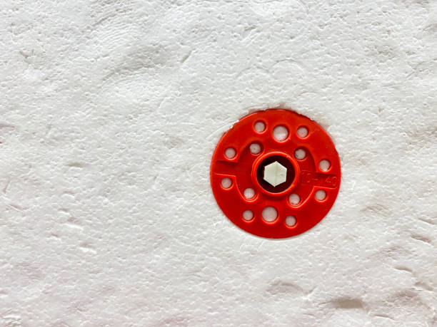 Full frame old, dimly illuminated white paper texture background.
