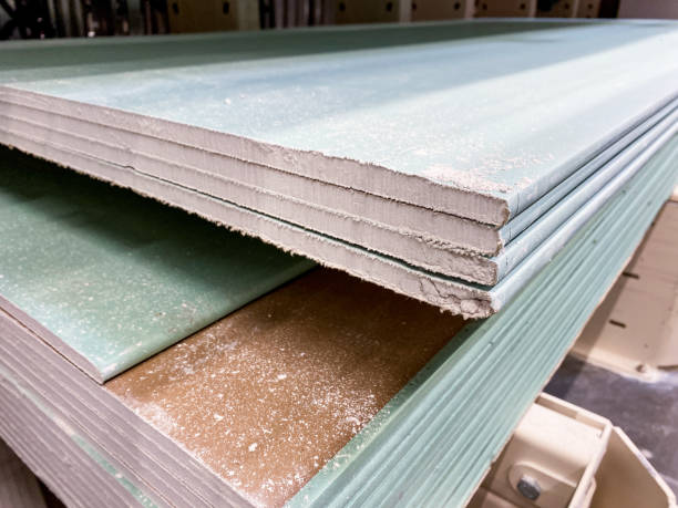 istock A stack of Green Gypsum Boards is fully prepared and ready for use in construction projects, providing essential features for quality building applications 2185080369