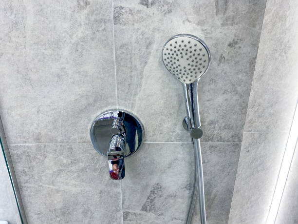 istock A modern shower head and control valve beautifully enhance a stylish bathroom setting, perfect for those seeking elegance and comfort in their relaxation spaces 2185080418
