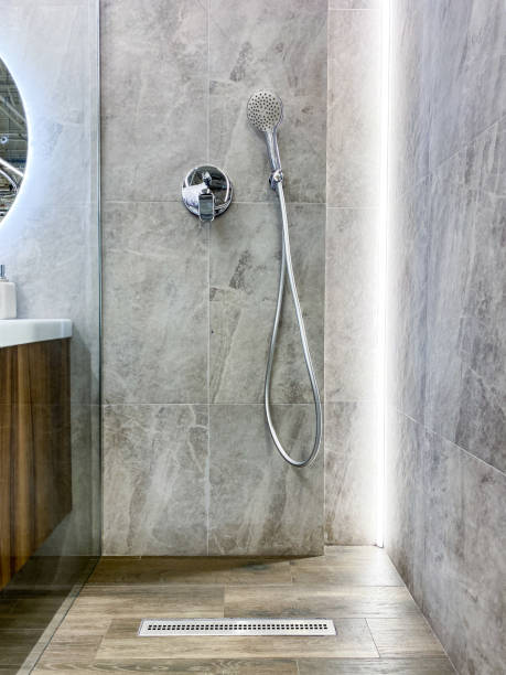 istock Modern bathrooms feature stylish walkin showers for easy access and sophistication, along with chic sinks that combine elegance with essential functionality for daily grooming 2185080424