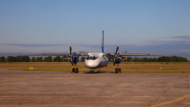 Ukrainian aircraft AN - 26 B. Plane Antonov AN-26b at airport. Ukrainian aircraft AN - 26 B. Plane Antonov AN-26b with propeller at airport runway apron. Ukraine, Kyiv - August 13, 2020 antonov an 26 stock pictures, royalty-free photos & images