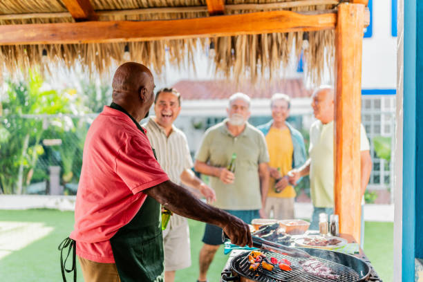 istock Senior friends men talking during barbecue at home 2185082370