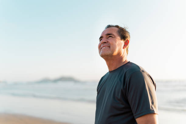 istock Senior man contemplating on the beach 2185082736