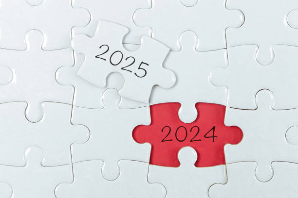 istock 2024, 2025 on puzzle background, business concept. 2185086914