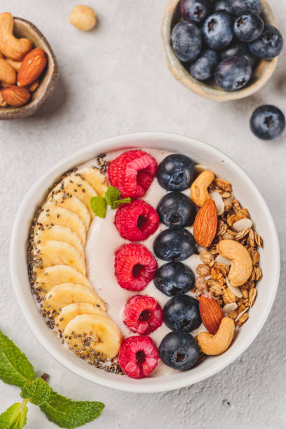 istock Smoothie bowl with raspberries and blueberries and nuts 2185089511