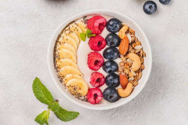 istock Smoothie bowl with raspberries and blueberries and nuts 2185089514