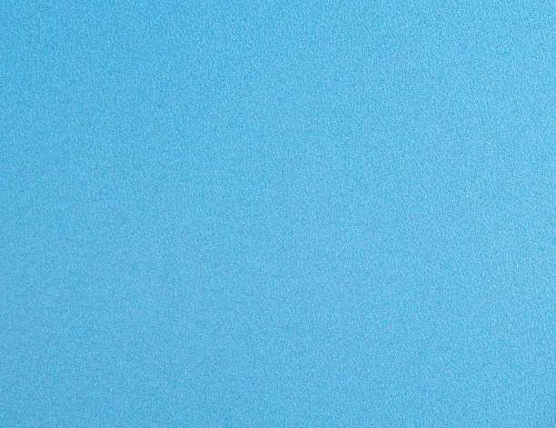 Elegant blue sky background with a soft, textured appearance and subtle star like accents, creating