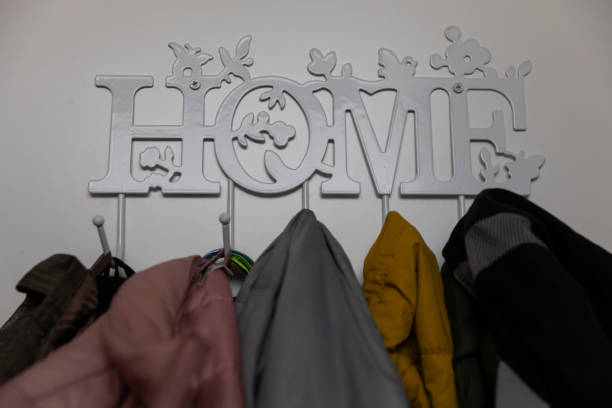 A chic and stylish entryway showcasing a beautiful decorative coat rack adorned with vibrant jackets hung neatly
