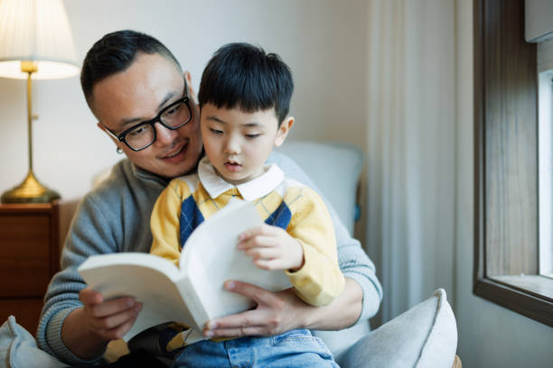 istock Asian father and son studying at home together 2185100651