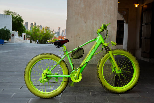 amateurishly painted fat-wheeled bicycle with fluorescent green paint